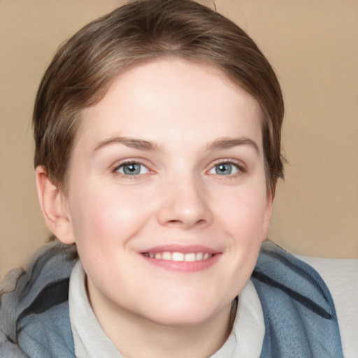 Joyful white young-adult female with medium  brown hair and blue eyes