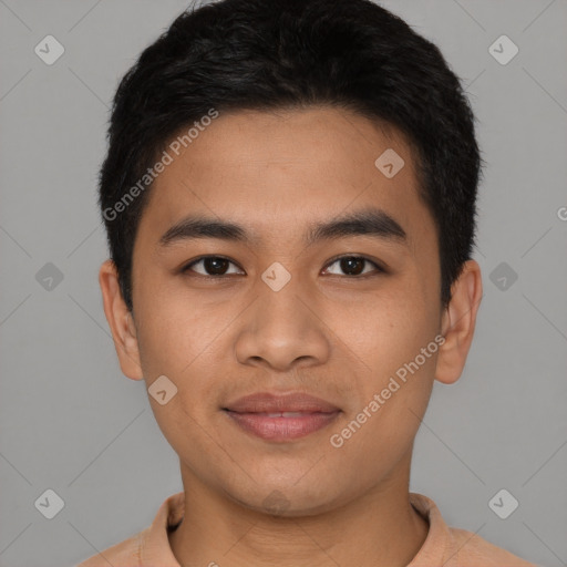 Joyful latino young-adult male with short  black hair and brown eyes