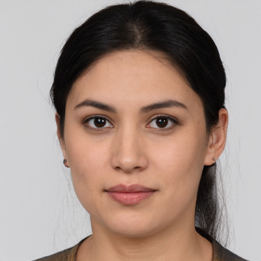 Joyful asian young-adult female with medium  brown hair and brown eyes