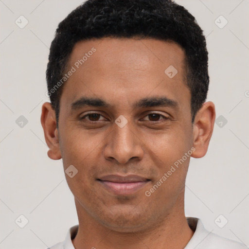 Joyful black young-adult male with short  black hair and brown eyes