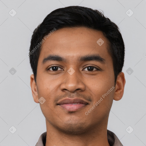 Joyful latino young-adult male with short  black hair and brown eyes