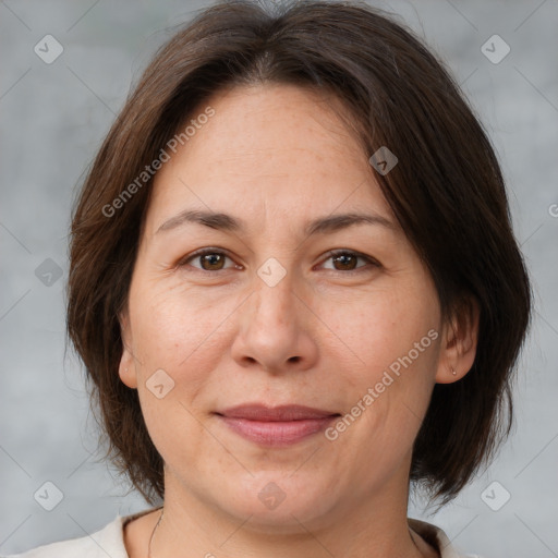 Joyful white adult female with medium  brown hair and brown eyes