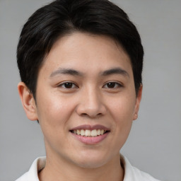 Joyful asian young-adult female with short  brown hair and brown eyes