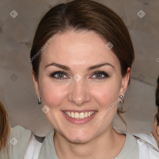 Joyful white young-adult female with medium  brown hair and blue eyes