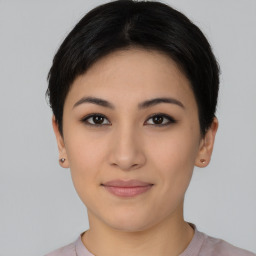 Joyful asian young-adult female with short  black hair and brown eyes