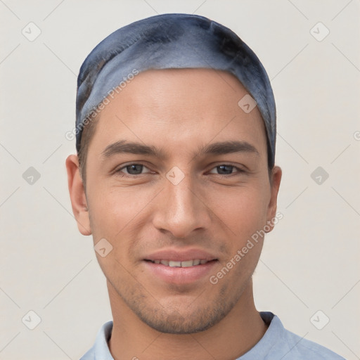 Joyful white young-adult male with short  black hair and brown eyes