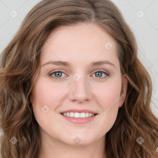 Joyful white young-adult female with long  brown hair and blue eyes