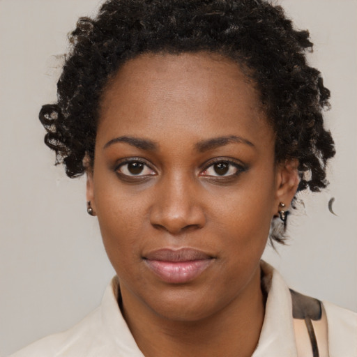 Neutral black young-adult female with short  brown hair and brown eyes