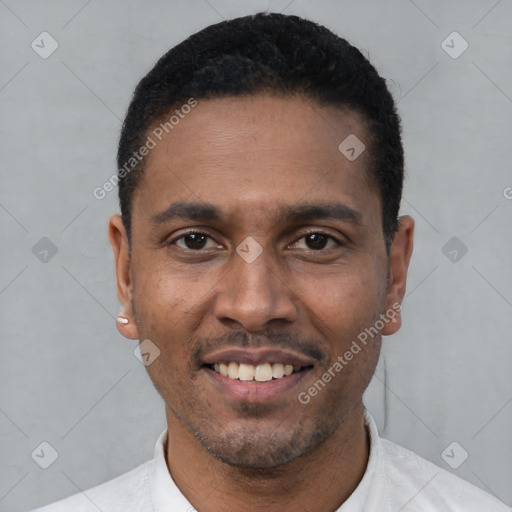 Joyful latino young-adult male with short  black hair and brown eyes