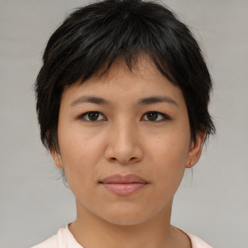 Joyful asian young-adult female with short  brown hair and brown eyes