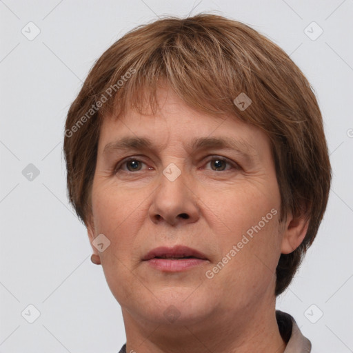 Joyful white adult female with short  brown hair and grey eyes