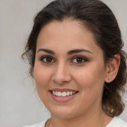 Joyful white young-adult female with medium  brown hair and brown eyes