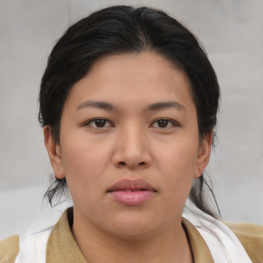Joyful asian young-adult female with medium  brown hair and brown eyes