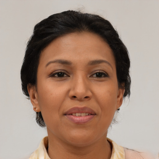 Joyful asian adult female with medium  brown hair and brown eyes