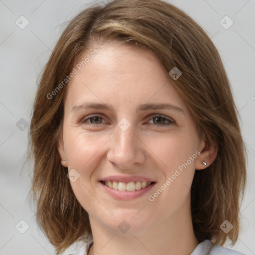 Joyful white young-adult female with medium  brown hair and grey eyes