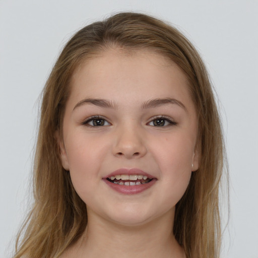 Joyful white child female with long  brown hair and brown eyes