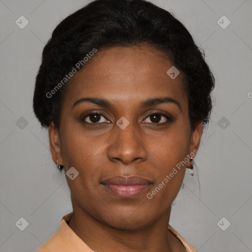 Joyful black young-adult female with short  brown hair and brown eyes