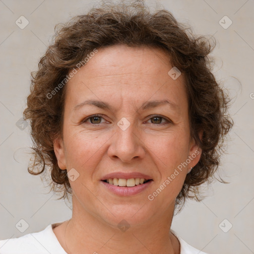 Joyful white adult female with short  brown hair and brown eyes