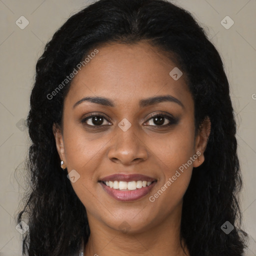 Joyful black young-adult female with long  brown hair and brown eyes