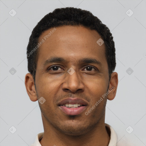 Joyful black young-adult male with short  black hair and brown eyes