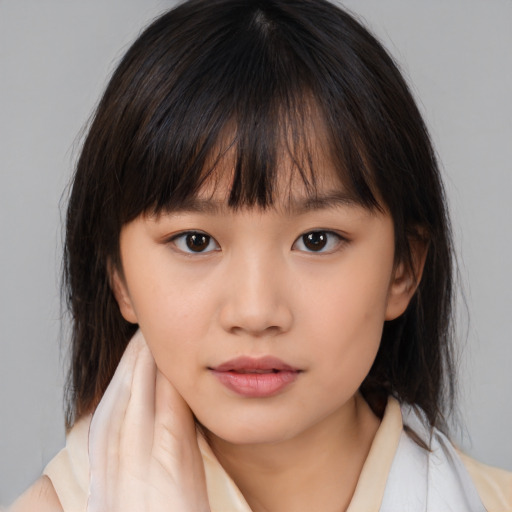 Neutral asian child female with medium  brown hair and brown eyes