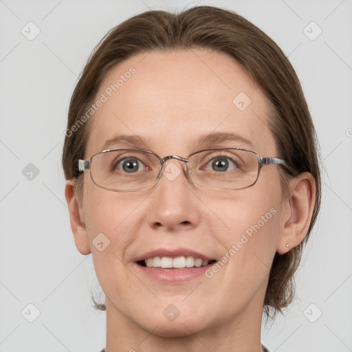 Joyful white adult female with medium  brown hair and grey eyes