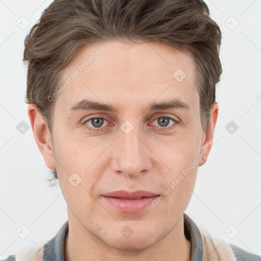 Joyful white adult male with short  brown hair and grey eyes