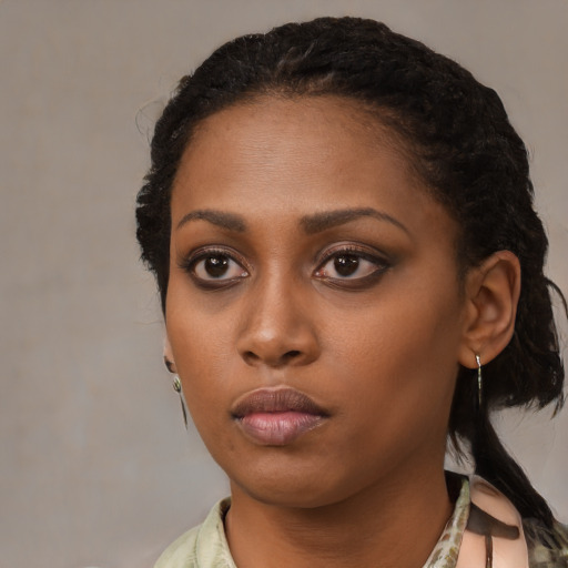 Neutral black young-adult female with medium  black hair and brown eyes