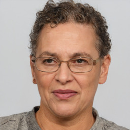 Joyful white middle-aged female with short  brown hair and brown eyes