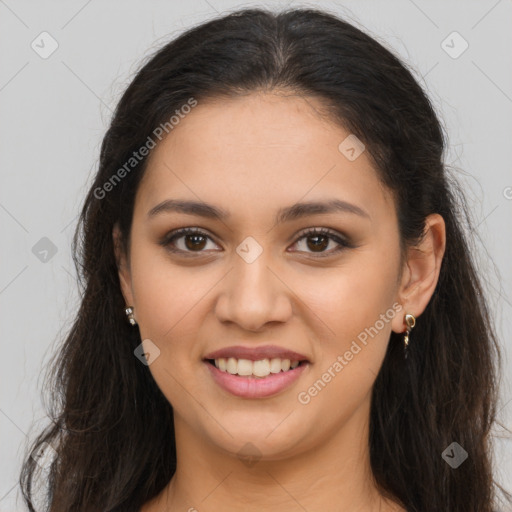 Joyful latino young-adult female with long  brown hair and brown eyes