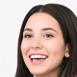 Joyful white young-adult female with long  black hair and brown eyes