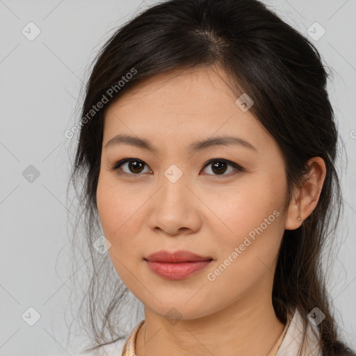 Joyful asian young-adult female with long  brown hair and brown eyes