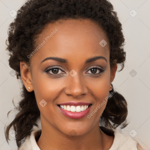 Joyful black young-adult female with medium  brown hair and brown eyes