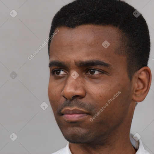 Neutral black young-adult male with short  black hair and brown eyes