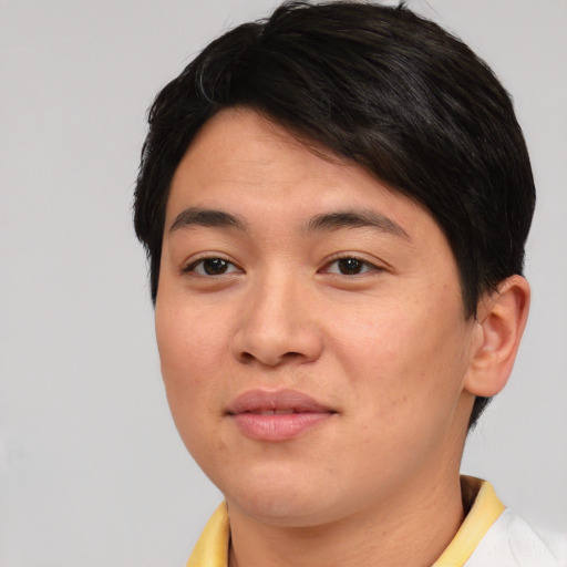 Joyful asian young-adult male with short  brown hair and brown eyes
