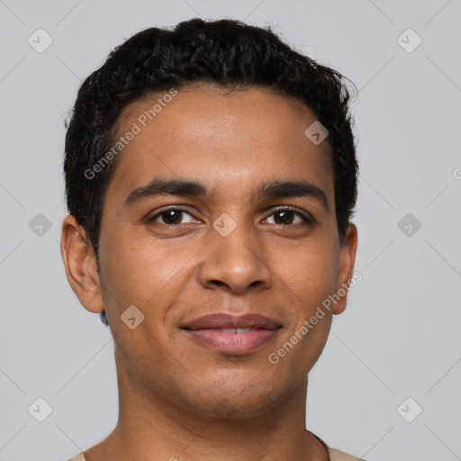 Joyful latino young-adult male with short  brown hair and brown eyes