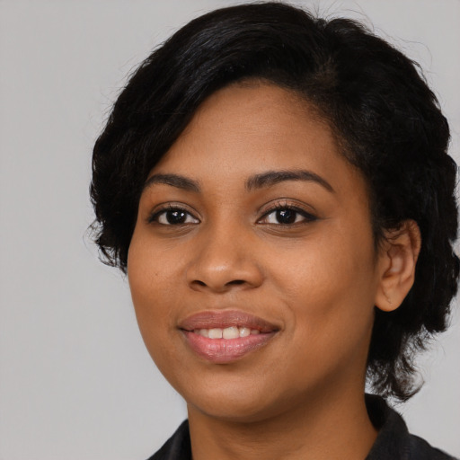 Joyful latino young-adult female with medium  black hair and brown eyes