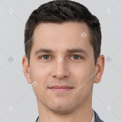 Joyful white young-adult male with short  brown hair and brown eyes