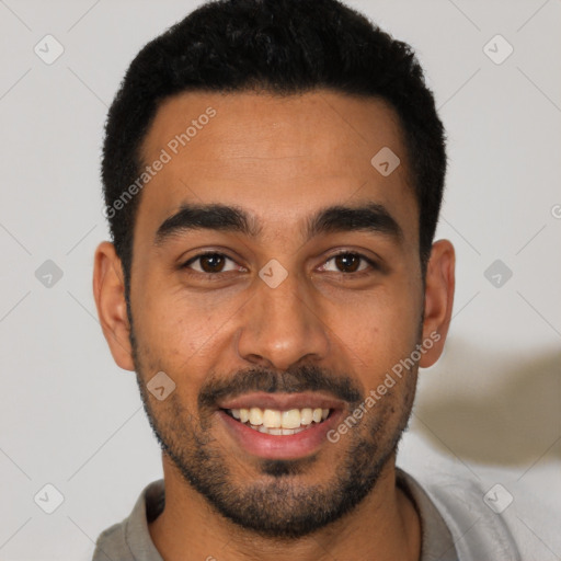 Joyful latino young-adult male with short  black hair and brown eyes