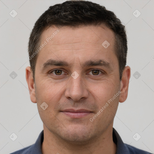 Joyful white adult male with short  brown hair and brown eyes