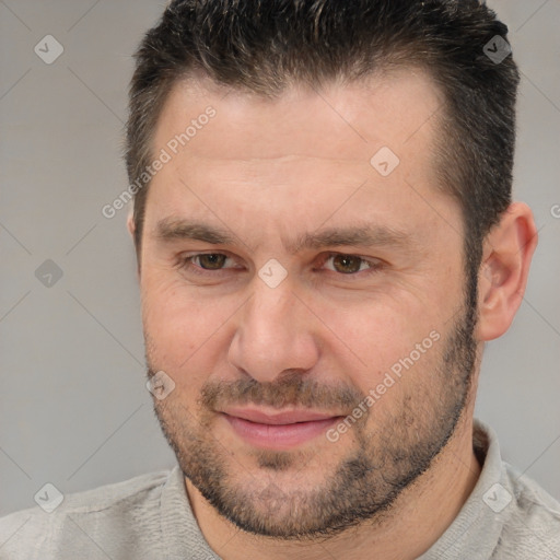 Joyful white adult male with short  brown hair and brown eyes