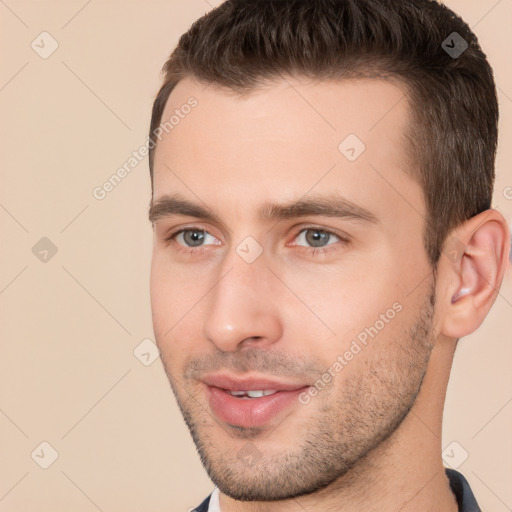 Joyful white young-adult male with short  brown hair and brown eyes