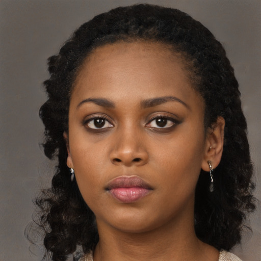 Neutral black young-adult female with medium  black hair and brown eyes