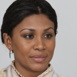 Joyful latino young-adult female with short  brown hair and brown eyes