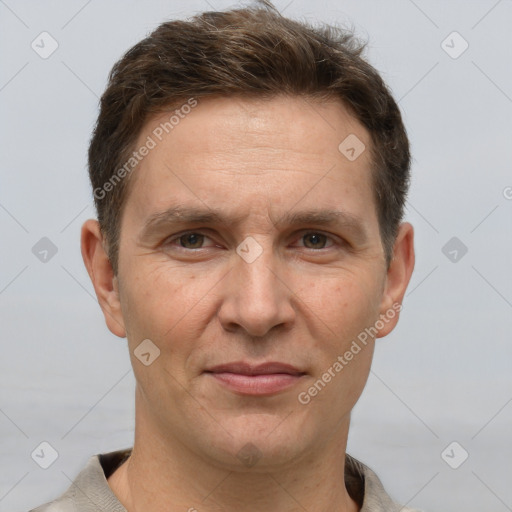 Joyful white adult male with short  brown hair and grey eyes