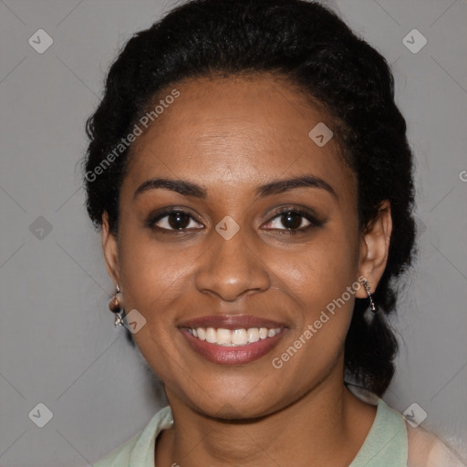 Joyful black young-adult female with short  black hair and brown eyes