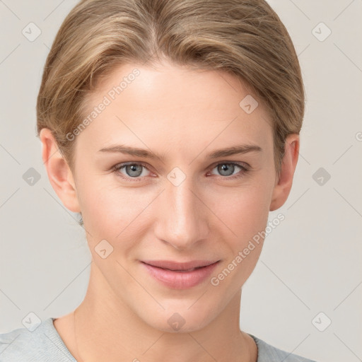 Joyful white young-adult female with short  brown hair and grey eyes