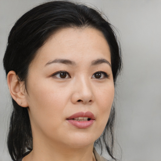 Neutral asian young-adult female with medium  brown hair and brown eyes
