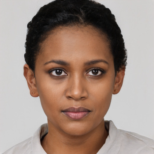 Neutral black young-adult female with short  black hair and brown eyes