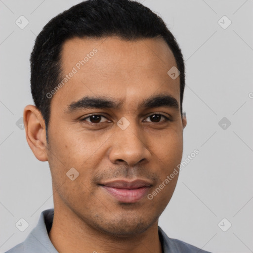 Joyful latino young-adult male with short  brown hair and brown eyes